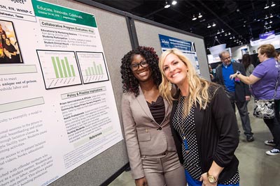 two nurses with their poster at exhibit hall at 2018 ANCC Magnet Conference